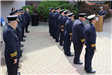 Backsides of uniformed individuals at the Memorial Day service