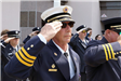 Close up of man in uniform saluting