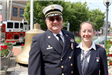 Man and woman pose for camera at the Memorial Day service