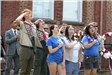 Crowd saluting the flag