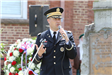 Uniformed man speaking at the Memorial Day service