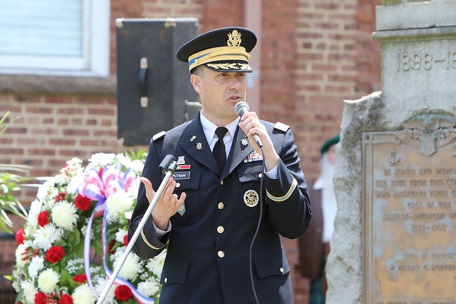 Uniformed man speaking at the Memorial Day service